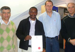 New members (l to r) Caleb Jacobs; Alain Nkodia; Michael Wright and Ian Hart receive their certificates.